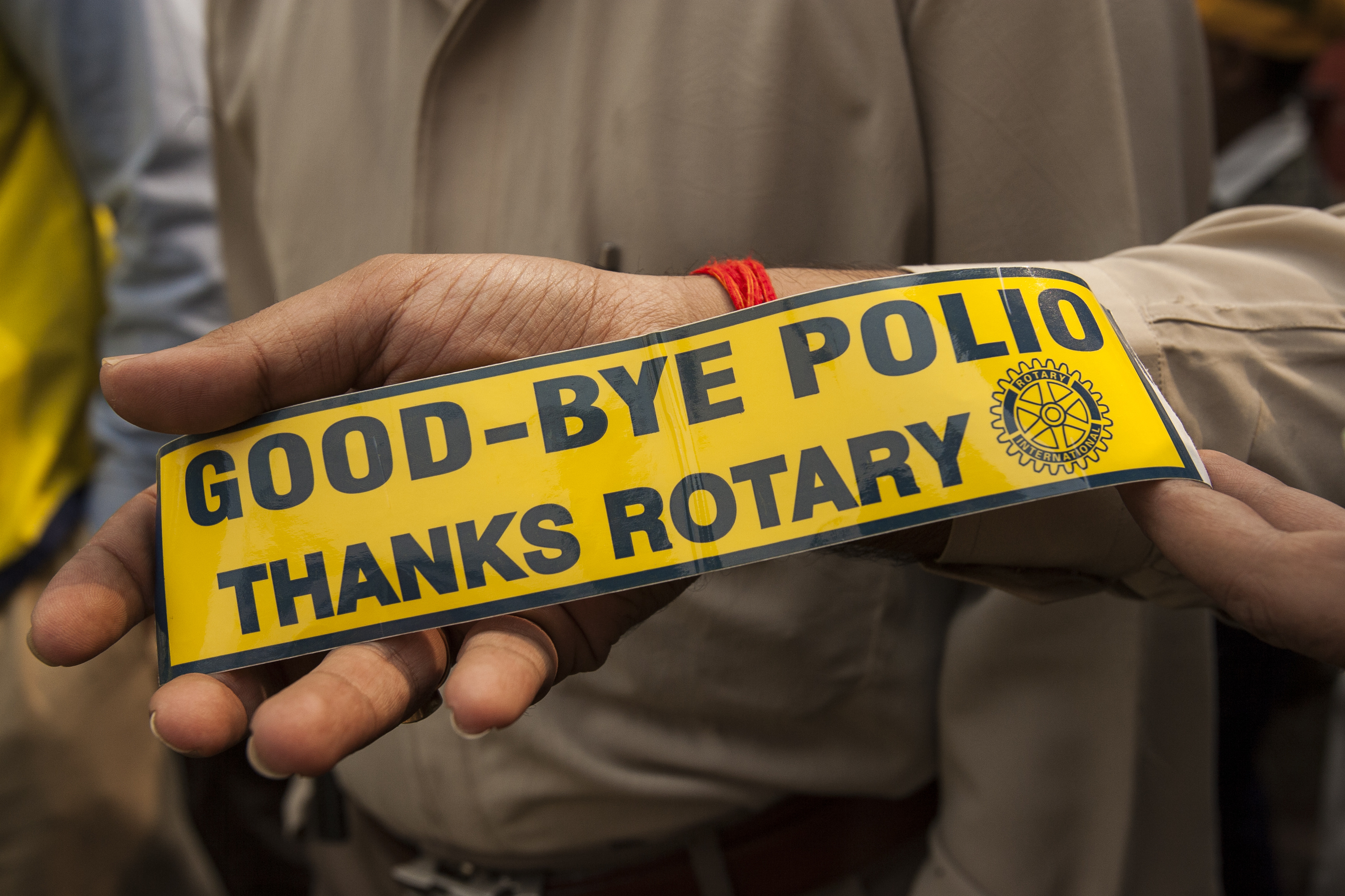 A Rotarian displays a Rotary sticker during a Subnational Immunization Day in Moradabad, Uttar Pradesh, India, 12 November 2006. Moradabad's 13 Rotary clubs sponsored 65 booths for the one-day event. Appeared in "The Rotarian," August 2007, page 46, and find the story in the April 2007 issue, pages 53-54.